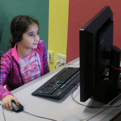 Girl looking at a computer
